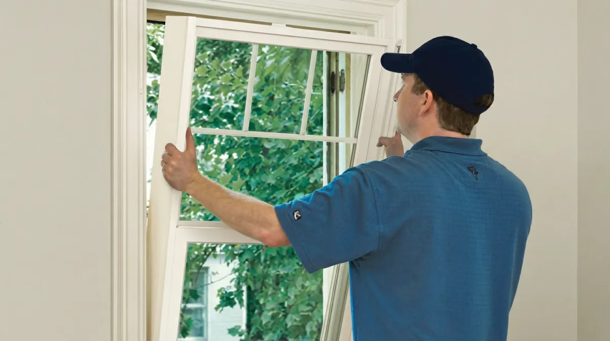 Professional contractors performing a residential window insulation and replacement service in Eugene, OR